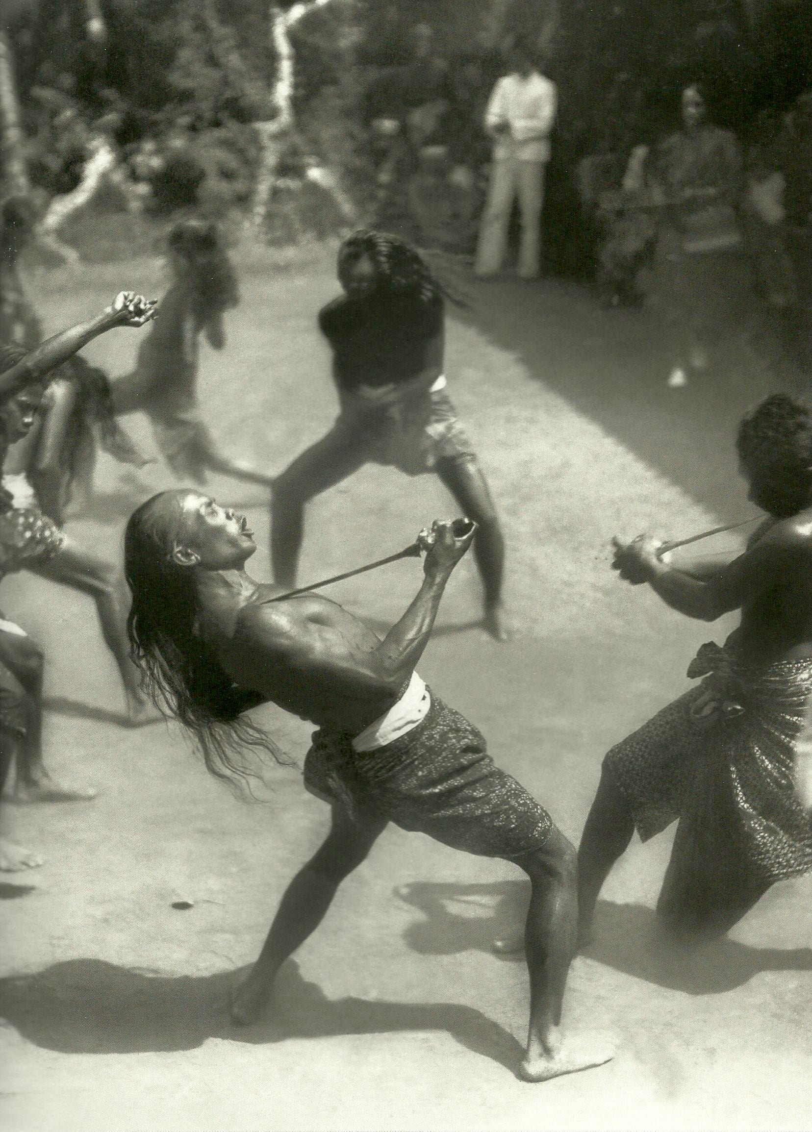 Male Kris dancers wrestling in a scene from the Ngureu. Bali, 1933.